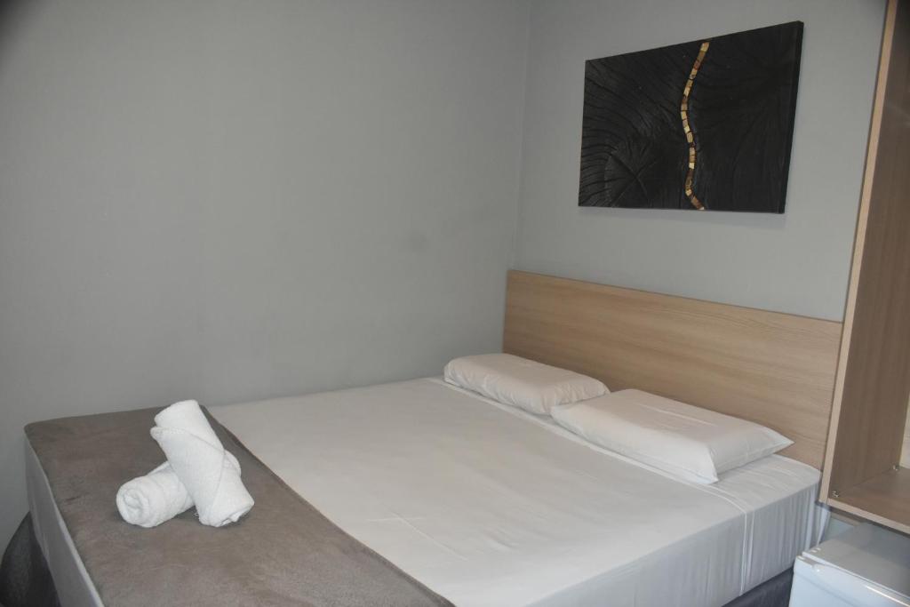Posteľ alebo postele v izbe v ubytovaní Unity Hotel - Votorantim - SP