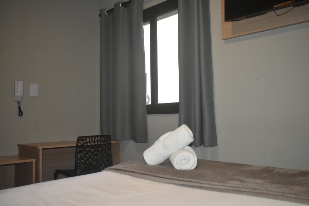 Posteľ alebo postele v izbe v ubytovaní Unity Hotel - Votorantim - SP