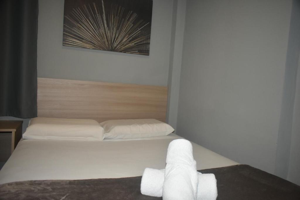Letto o letti in una camera di Unity Hotel - Votorantim - SP