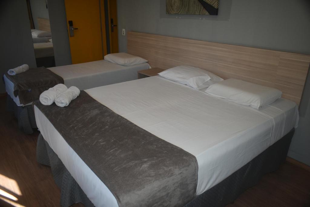 Posteľ alebo postele v izbe v ubytovaní Unity Hotel - Votorantim - SP