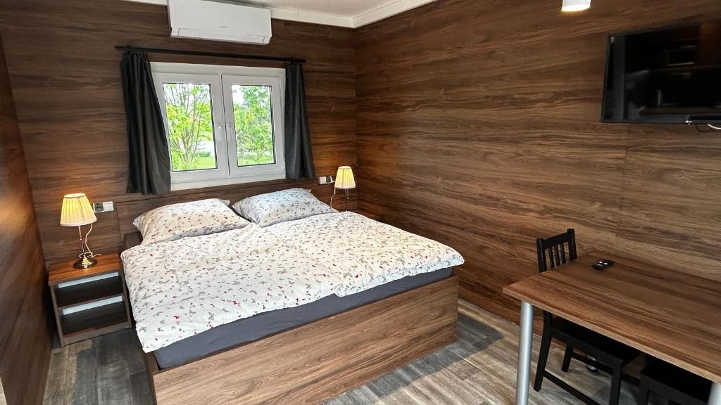 Postel nebo postele na pokoji v ubytování Apartmány Štramberk
