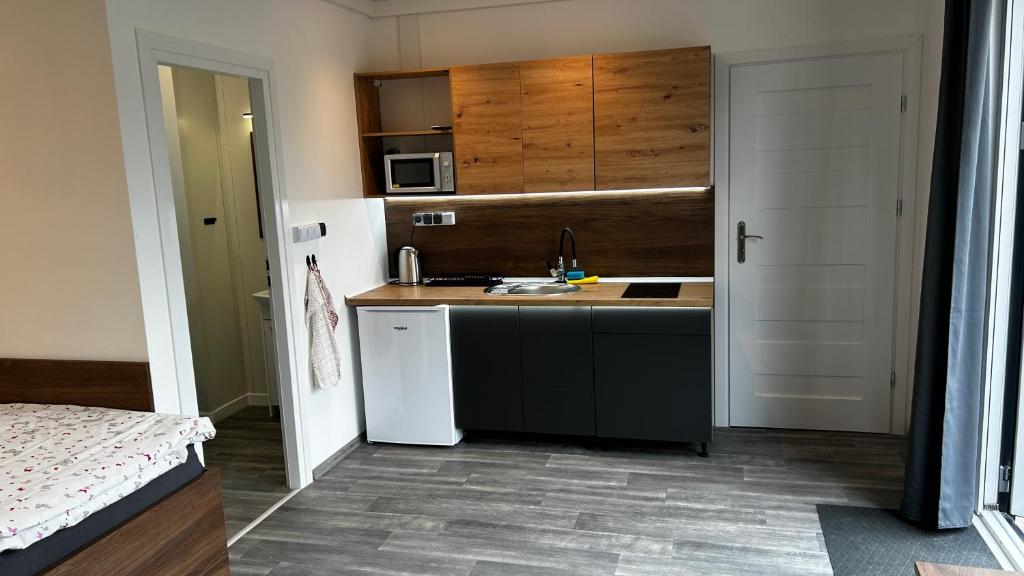 Postel nebo postele na pokoji v ubytování Apartmány Štramberk