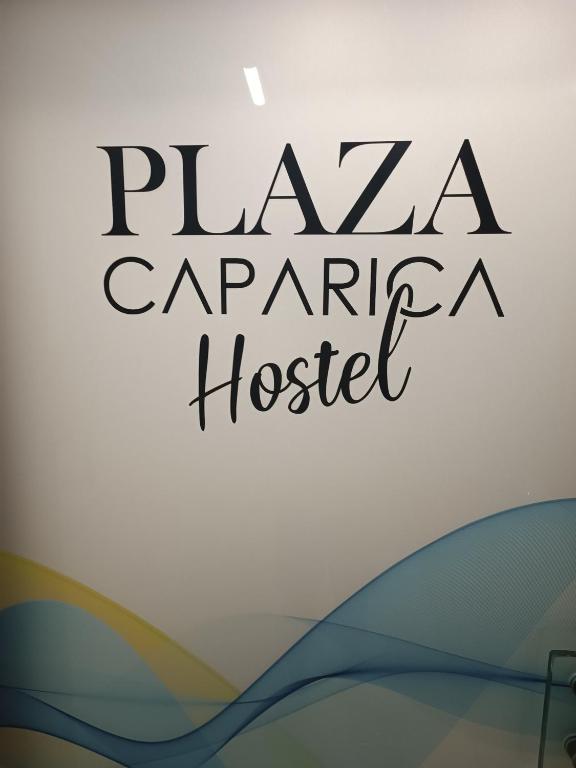 a sign for a pizza carnegie hospital at Plaza Caparica Hostel in Costa da Caparica