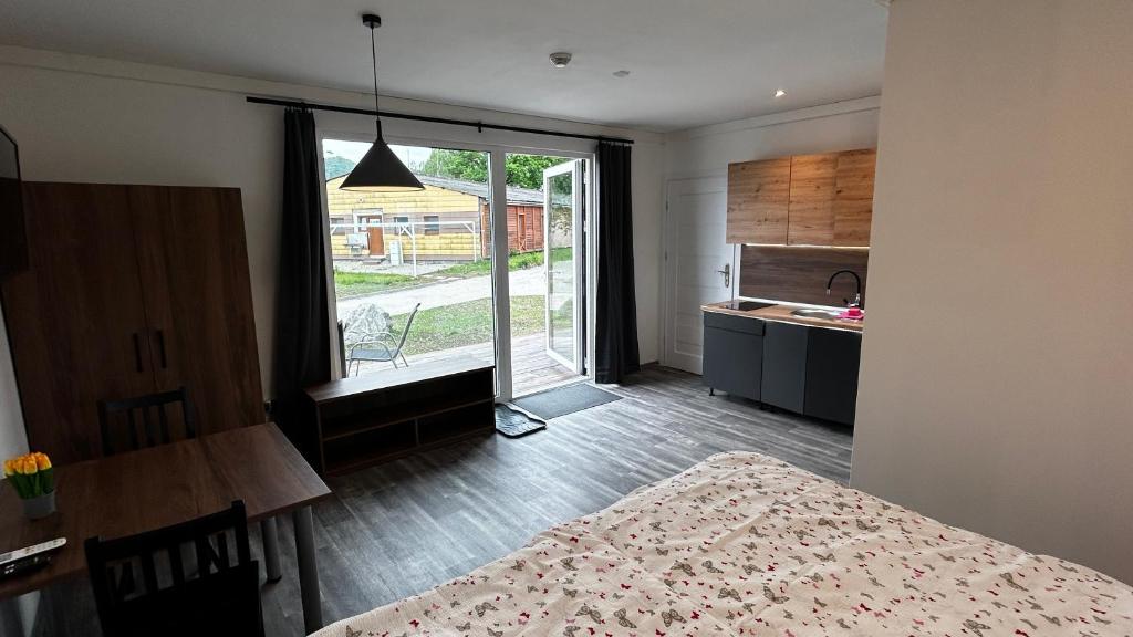 Postel nebo postele na pokoji v ubytování Apartmány Štramberk