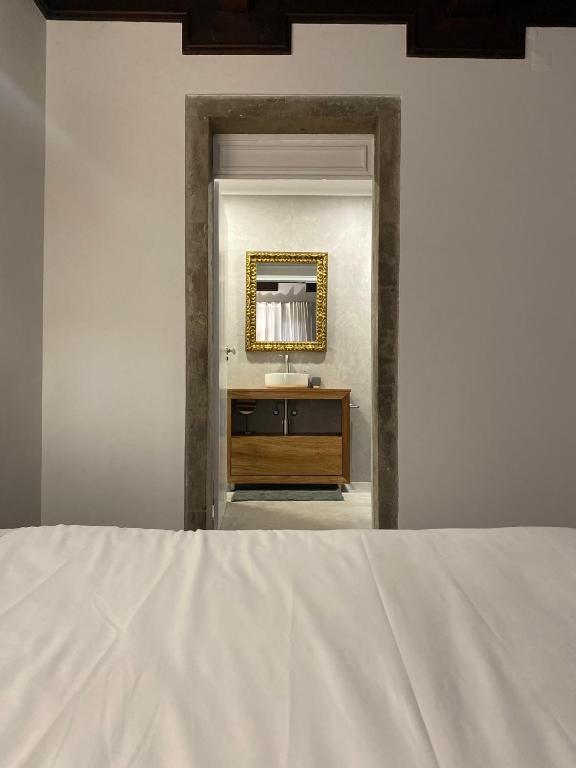 Postel nebo postele na pokoji v ubytování CASA de FORO - Apartamentos Turísticos