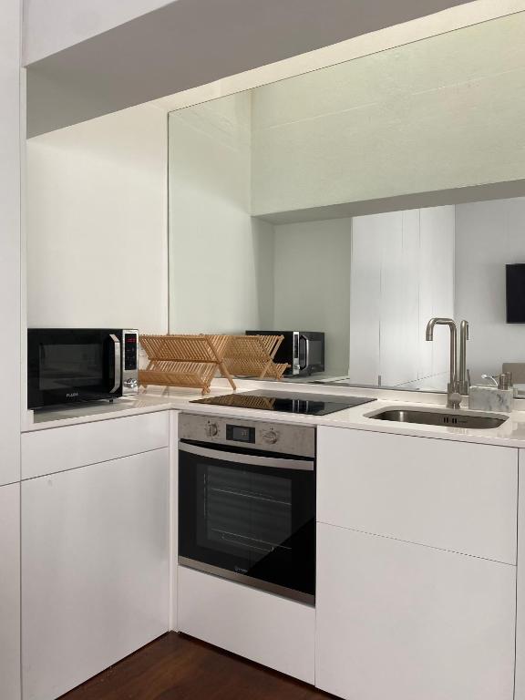 Kuchyň nebo kuchyňský kout v ubytování CASA de FORO - Apartamentos Turísticos