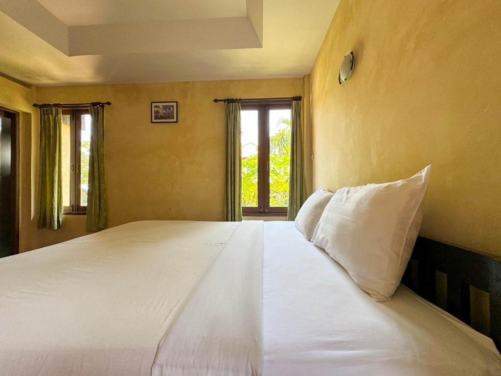 Postel nebo postele na pokoji v ubytování Baan Bali Beach Resort Pranburi