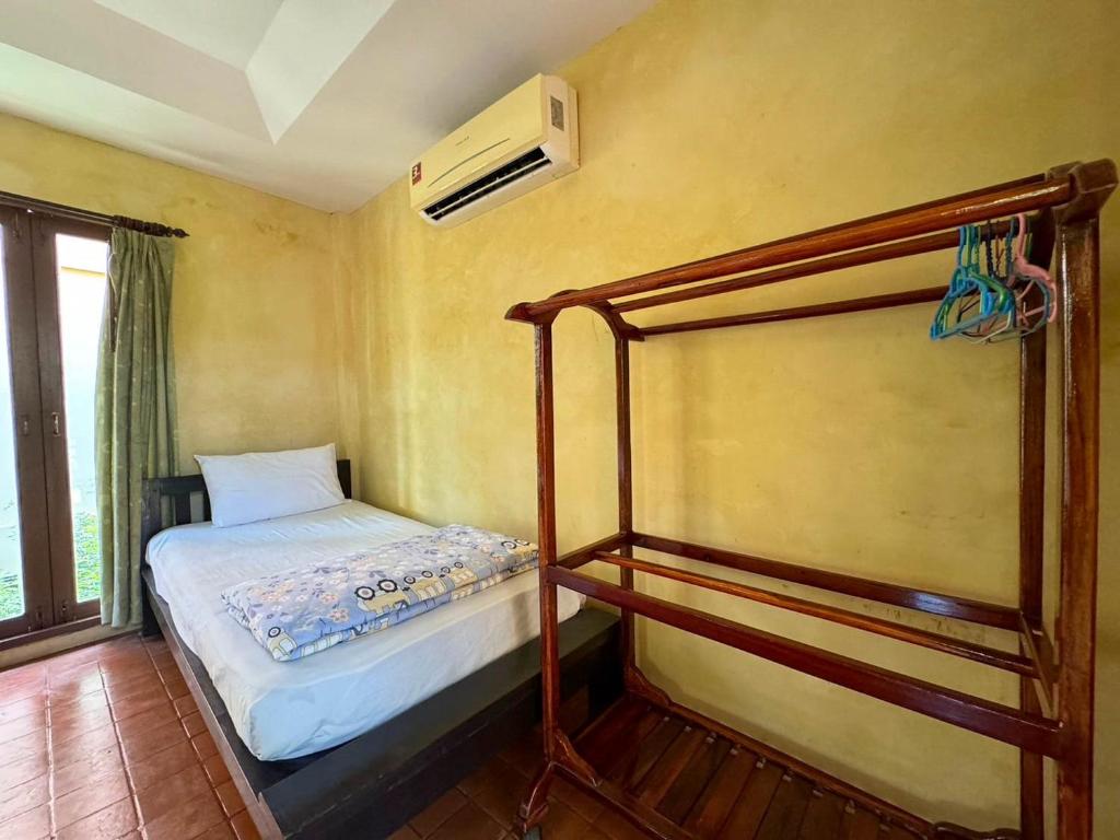 Postel nebo postele na pokoji v ubytování Baan Bali Beach Resort Pranburi