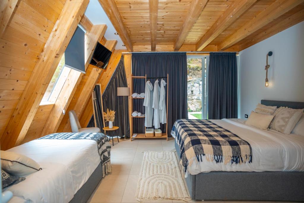 Postel nebo postele na pokoji v ubytování Vidis Chalet Boutique Hotel