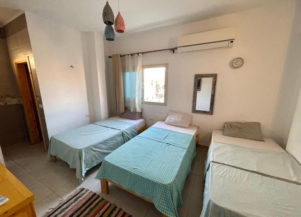 Postel nebo postele na pokoji v ubytování Sky Dahab Hotel