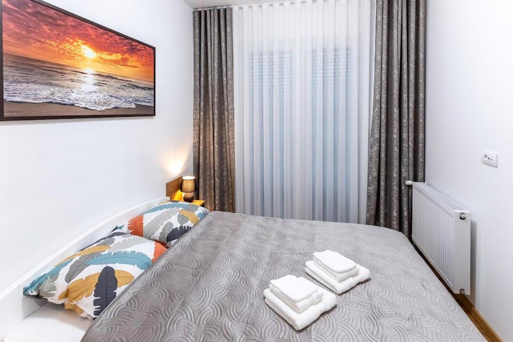 Postel nebo postele na pokoji v ubytování Apartman Kolarević