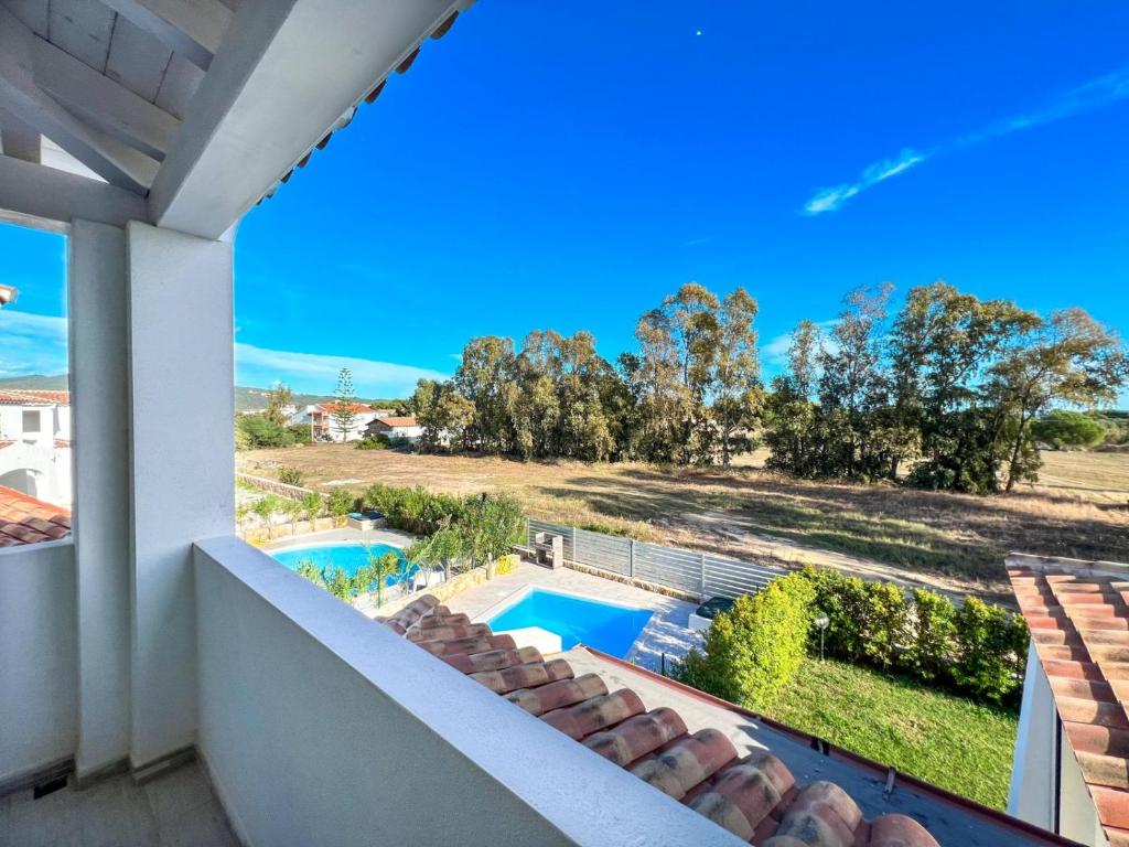 a view of the pool from the balcony of a house at La Residenza del Mare in Limpiddu