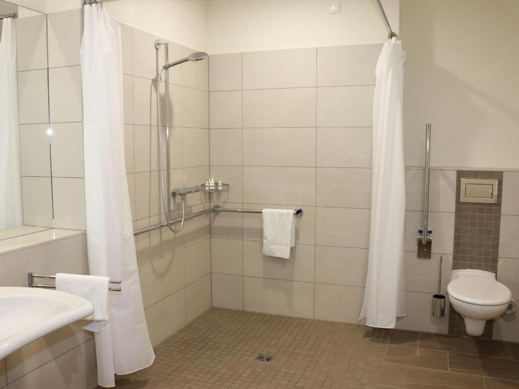 Koupelna v ubytování Leben wie im Hotel by Helios