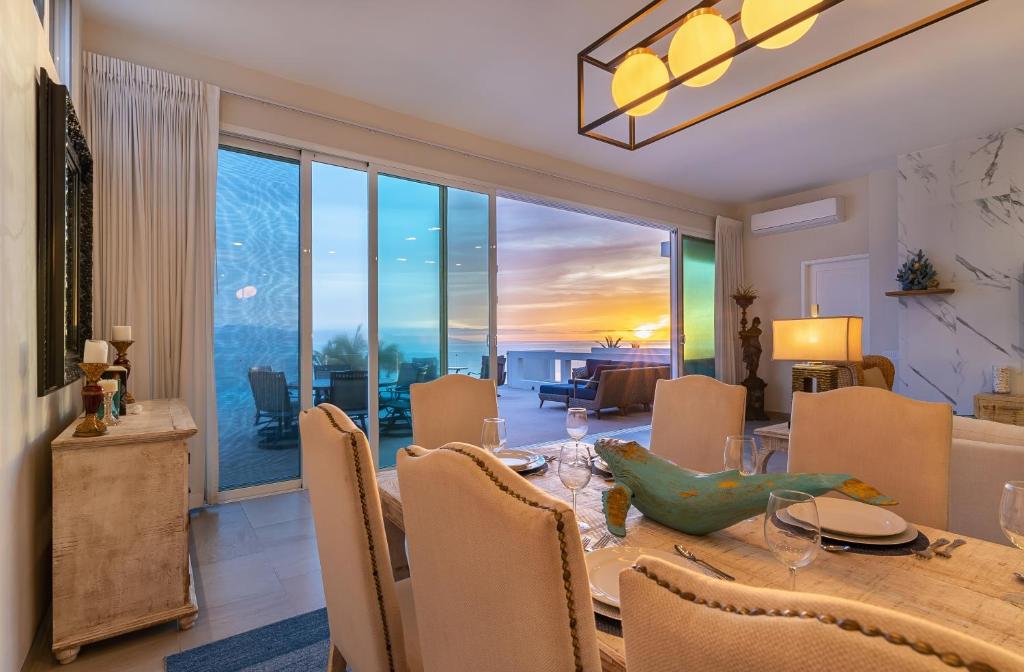 a dining room with a table and chairs with a view at Palacio Blanco Luxury Villa 3 in La Ventana