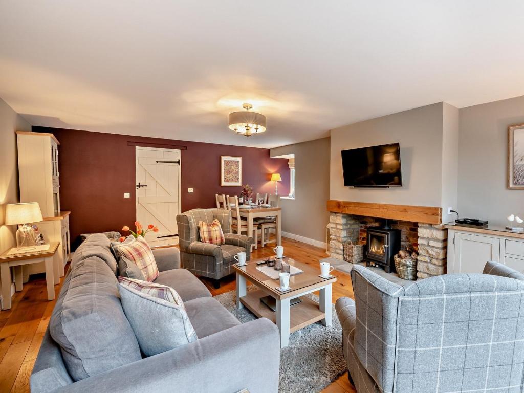 a living room with two couches and a fireplace at 2 Bed in Scarborough 79523 in Sawdon