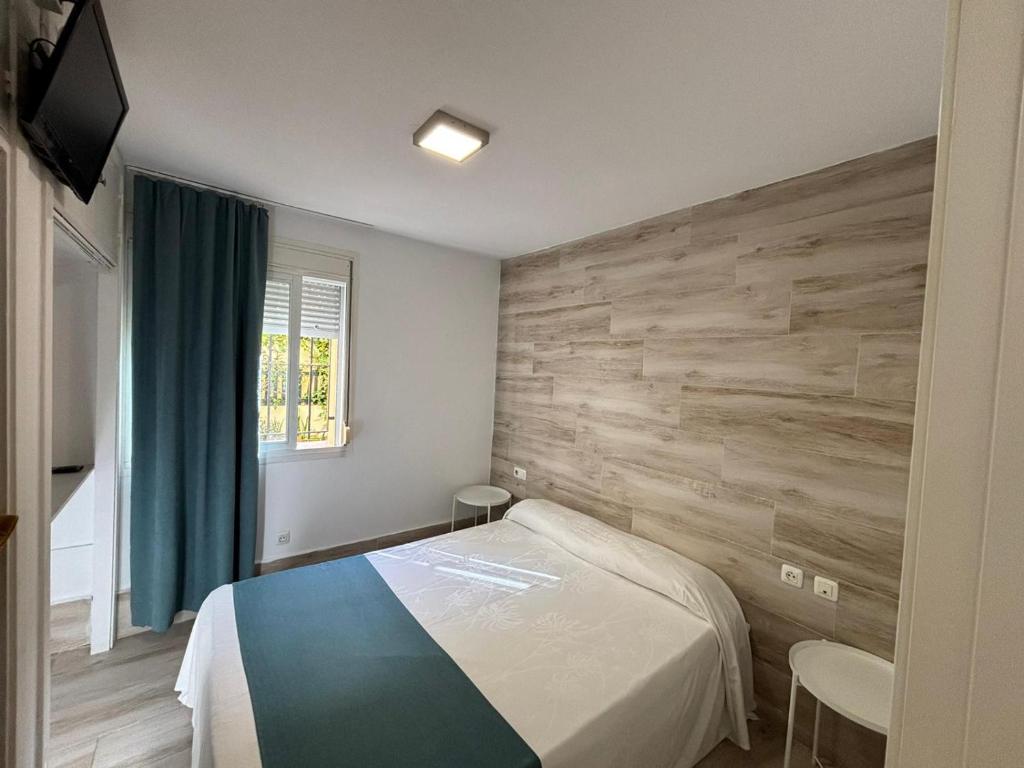 Ένα ή περισσότερα κρεβάτια σε δωμάτιο στο Hospederia Imar