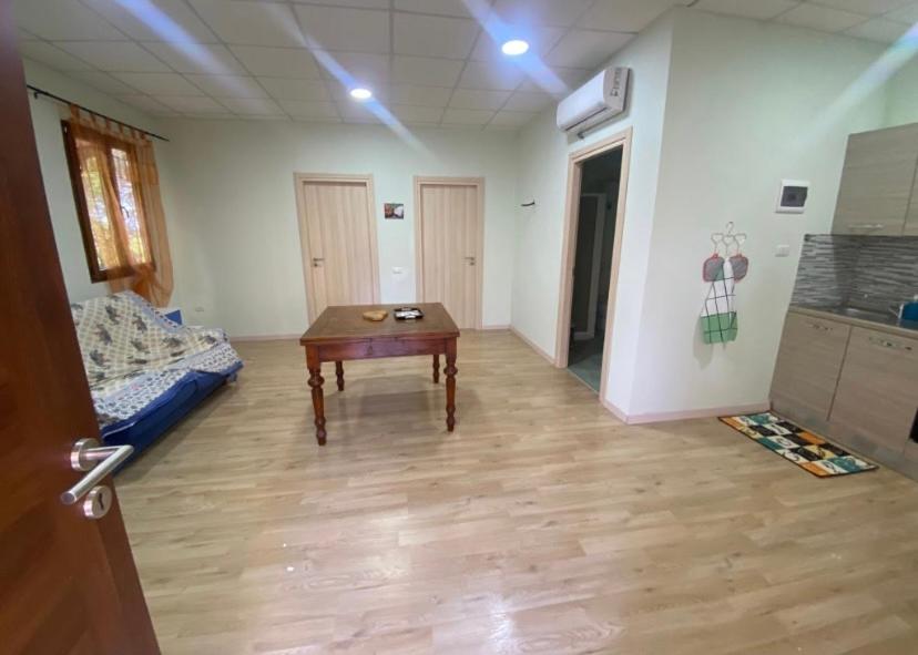 a room with a table in the middle of a room at Verde in Piombino