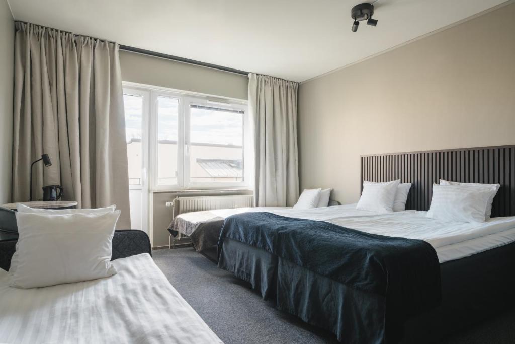 Postel nebo postele na pokoji v ubytování VICI Hotels Linköping