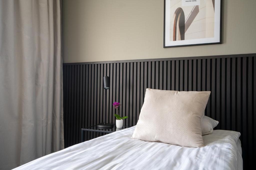 Postel nebo postele na pokoji v ubytování VICI Hotels Linköping