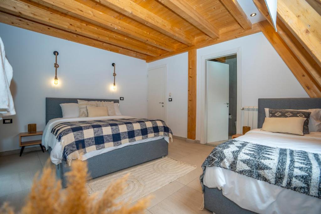 Postel nebo postele na pokoji v ubytování Vidis Chalet Boutique Hotel