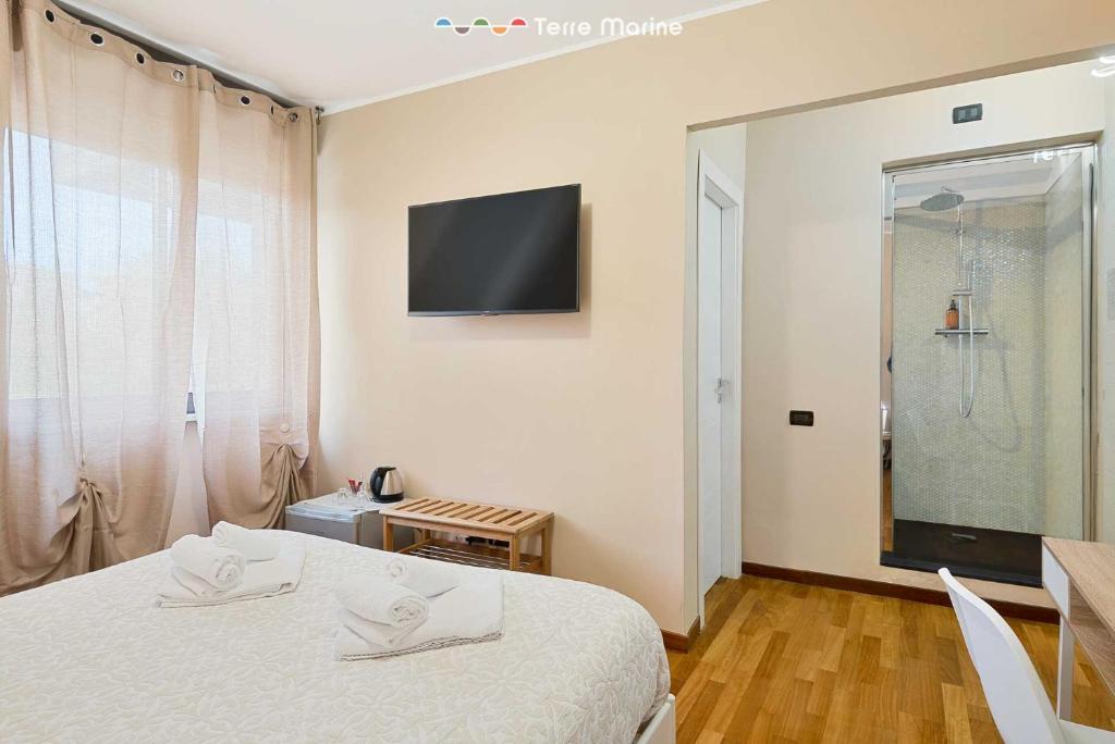 Postel nebo postele na pokoji v ubytování La Rosa del Golfo dei Poeti