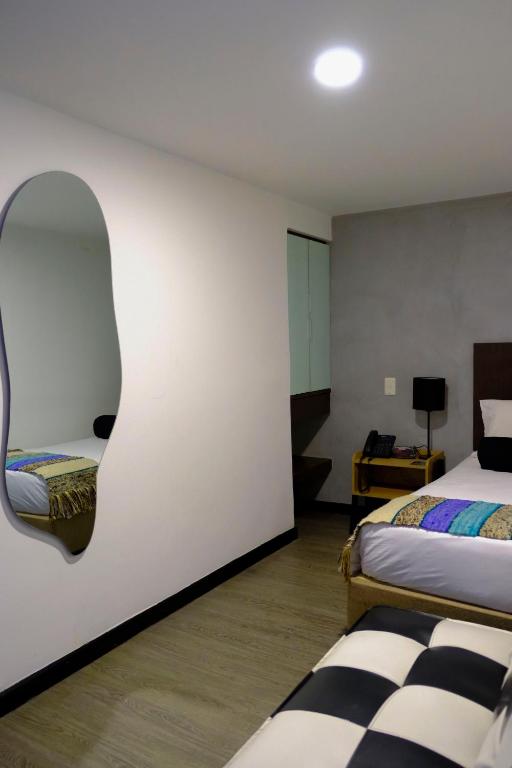 Postel nebo postele na pokoji v ubytování Hotel DC Feria