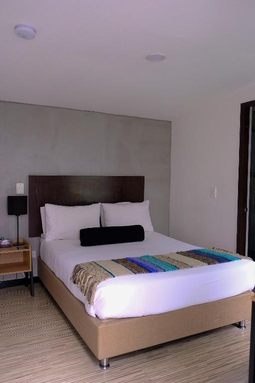 Postel nebo postele na pokoji v ubytování Hotel DC Feria