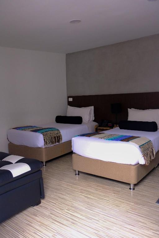 Postel nebo postele na pokoji v ubytování Hotel DC Feria