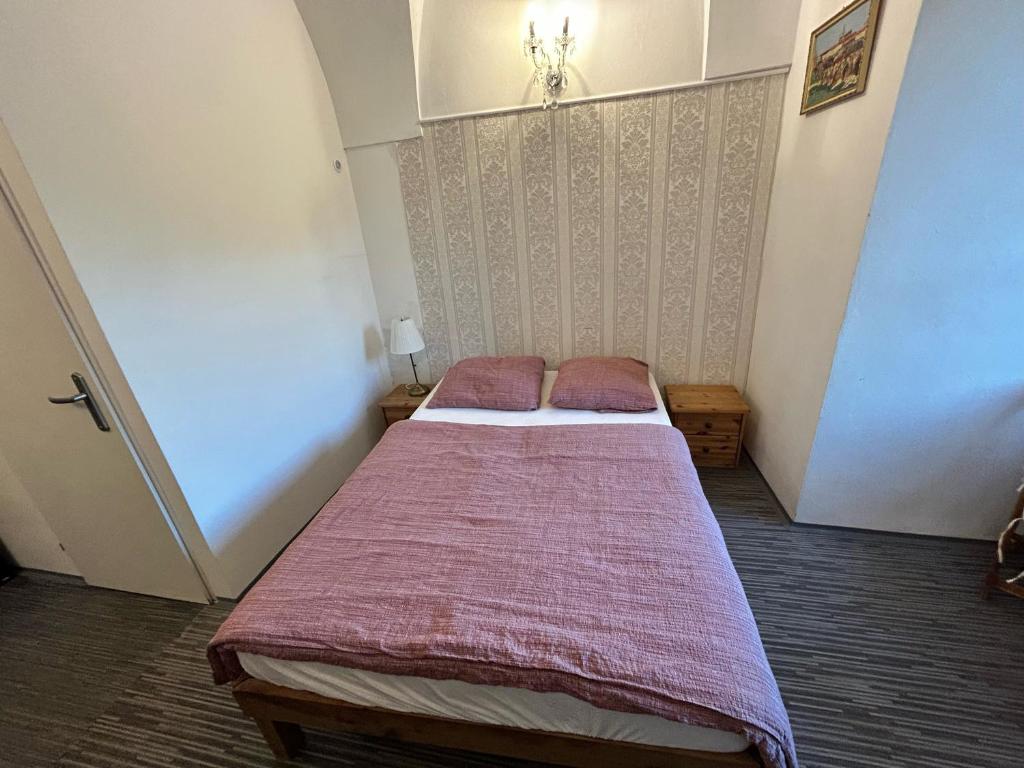 Postel nebo postele na pokoji v ubytování Rezidence Napoleon