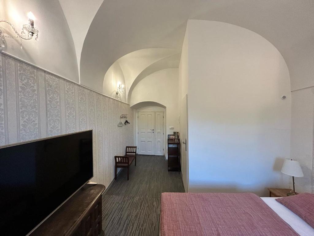 Postel nebo postele na pokoji v ubytování Rezidence Napoleon