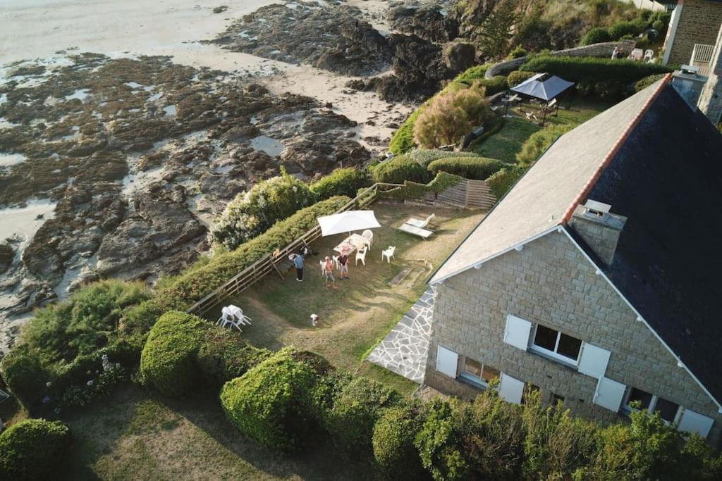 an aerial view of a house with horses near the ocean at Coin de paradis inoubliable in Lancieux