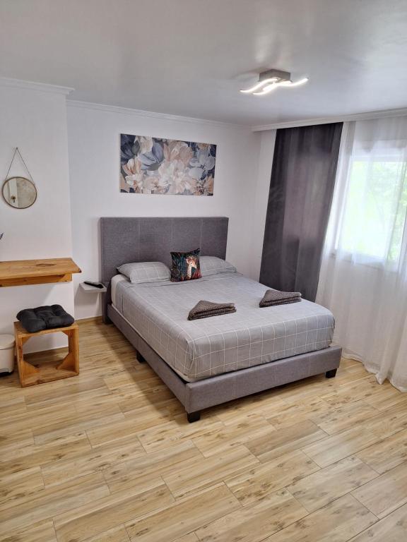 a bedroom with a bed and a wooden floor at Sweet dreams in Alicante