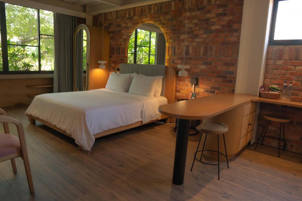 Postel nebo postele na pokoji v ubytování Nomada Hotel Origen