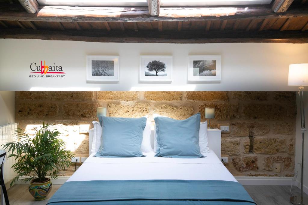Postel nebo postele na pokoji v ubytování B&B Cubbaita