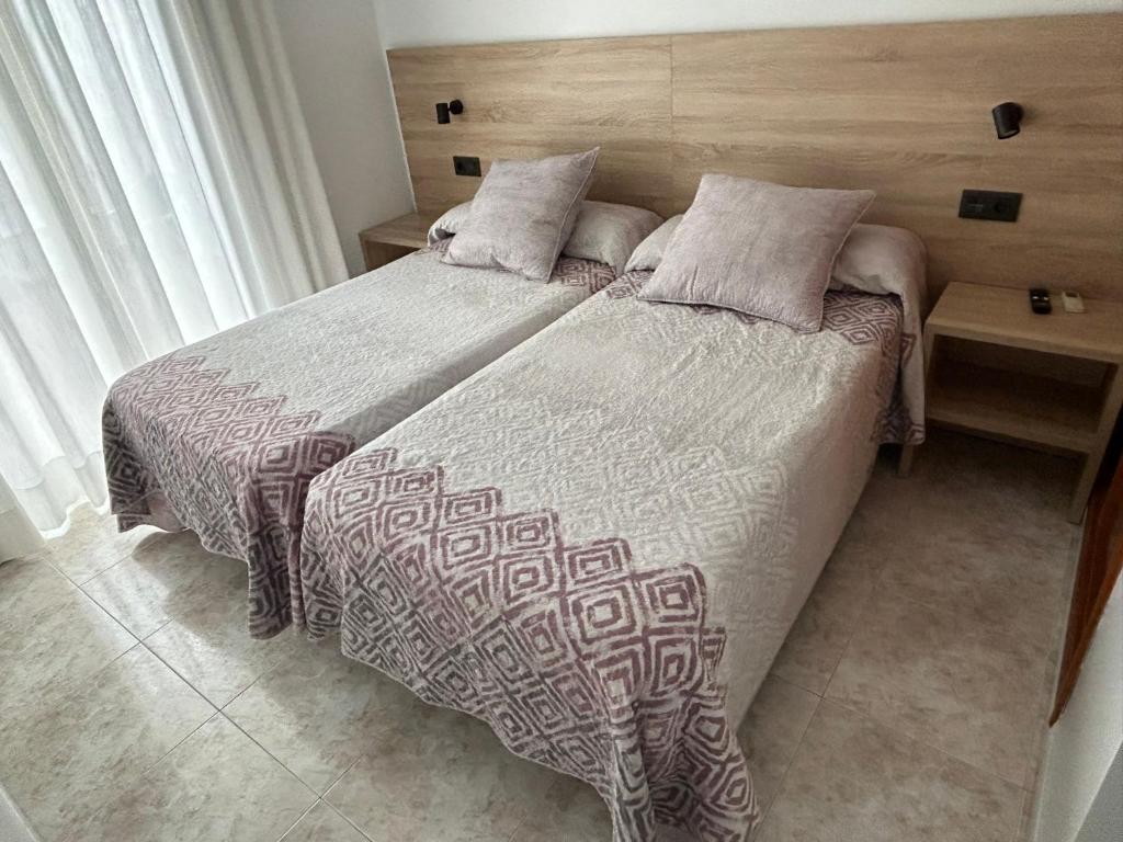 Posteľ alebo postele v izbe v ubytovaní Hostal Juan Carlos