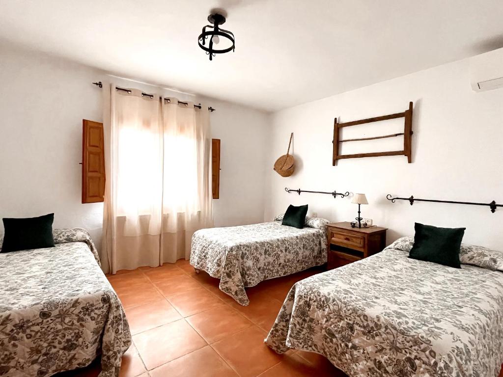 Een bed of bedden in een kamer bij Casa Rural Pernales II