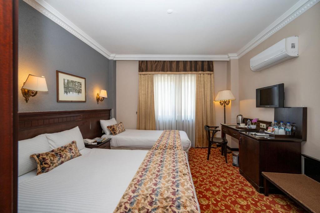 Кровать или кровати в номере Pera Rose Hotel - Taksim Pera
