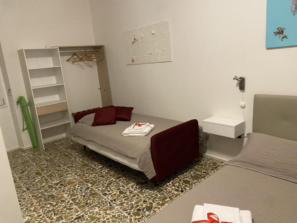 Postel nebo postele na pokoji v ubytování Rossocorallo Rooms