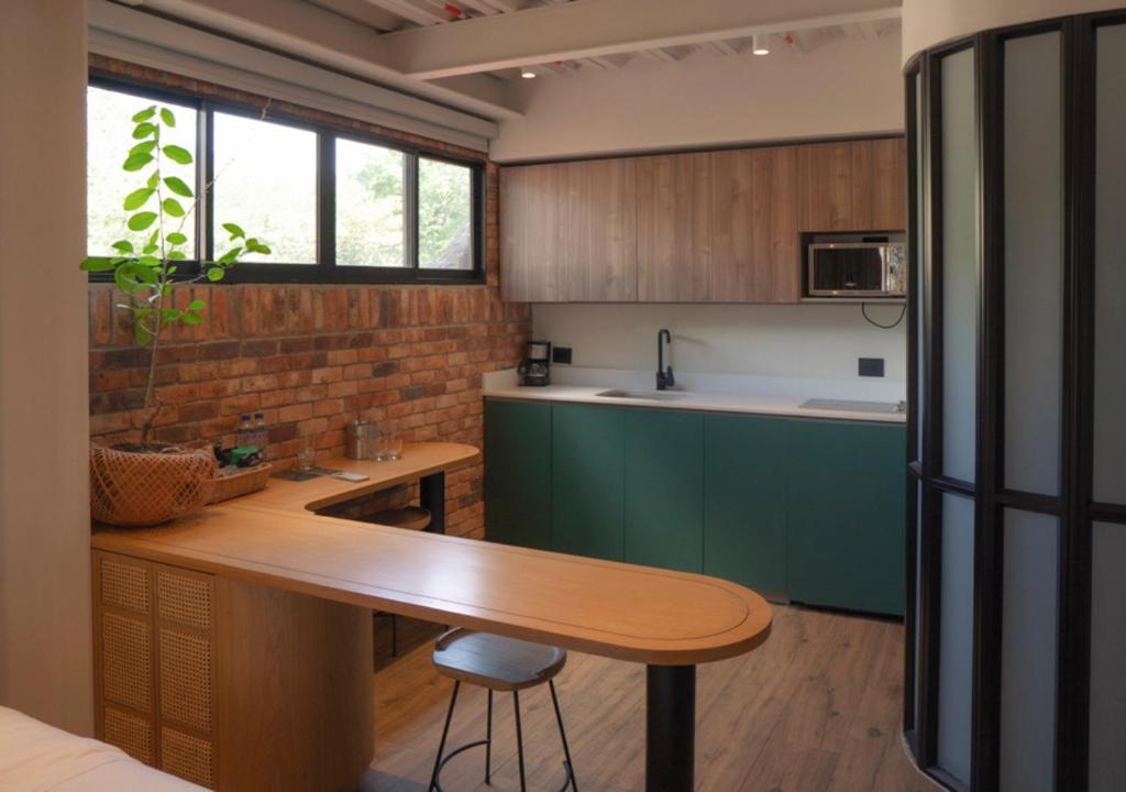 Kuchyň nebo kuchyňský kout v ubytování Nomada Hotel Origen