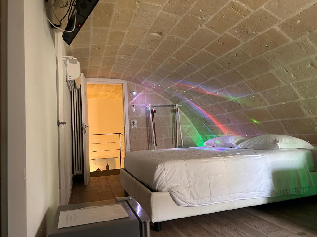 Postel nebo postele na pokoji v ubytování Recinto antico Sweet Rooms