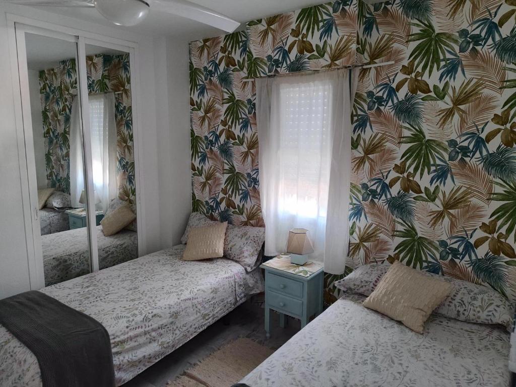 Posteľ alebo postele v izbe v ubytovaní BENALMAR PLAYA