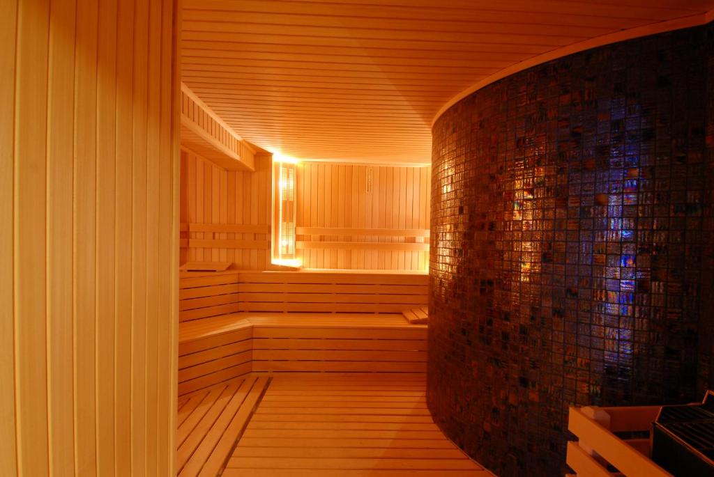 a sauna with wooden floors and a brick wall at Mosaic Hotel Old City -Special Category in Istanbul