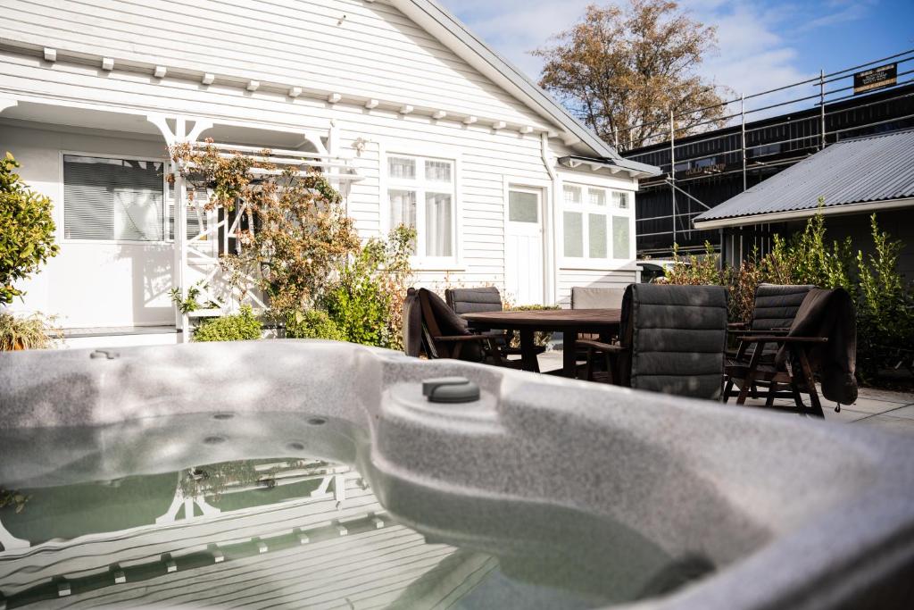 a bath tub in front of a house at Charming 1920s Villa on Bealey Ave in Christchurch