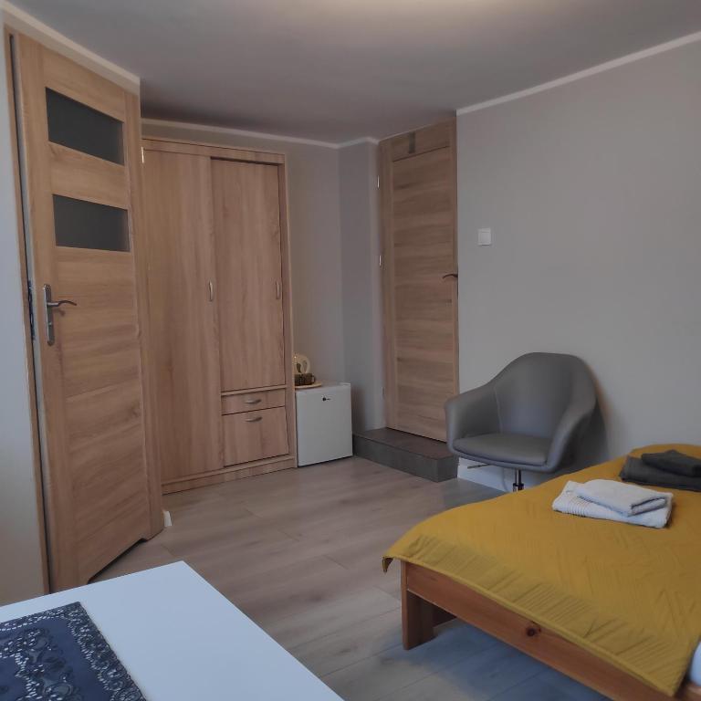Postel nebo postele na pokoji v ubytování Pokoje gościnne Moli