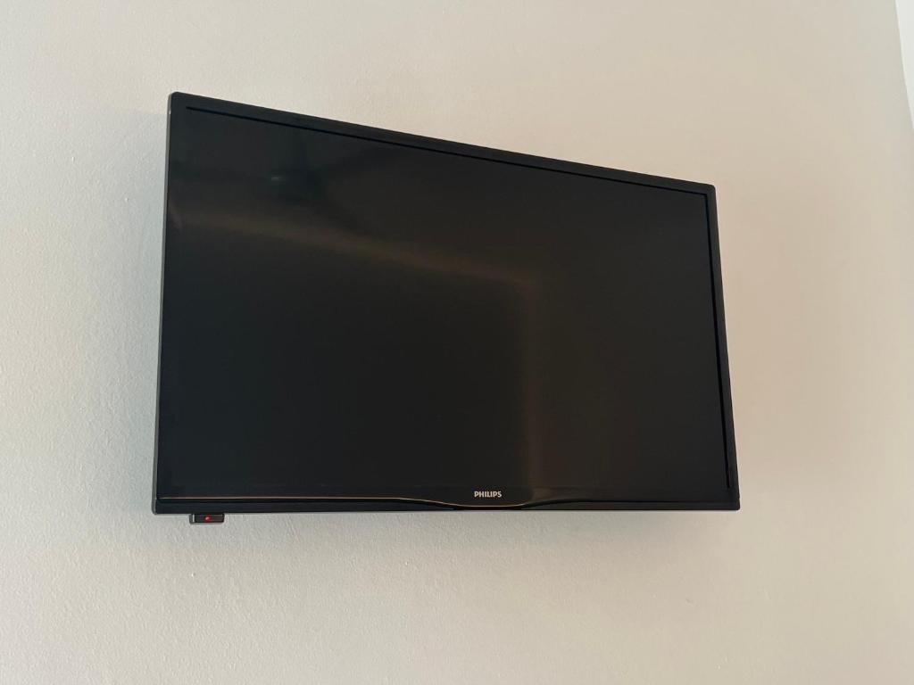 TV a/nebo společenská místnost v ubytování Hostal ROM Familiar