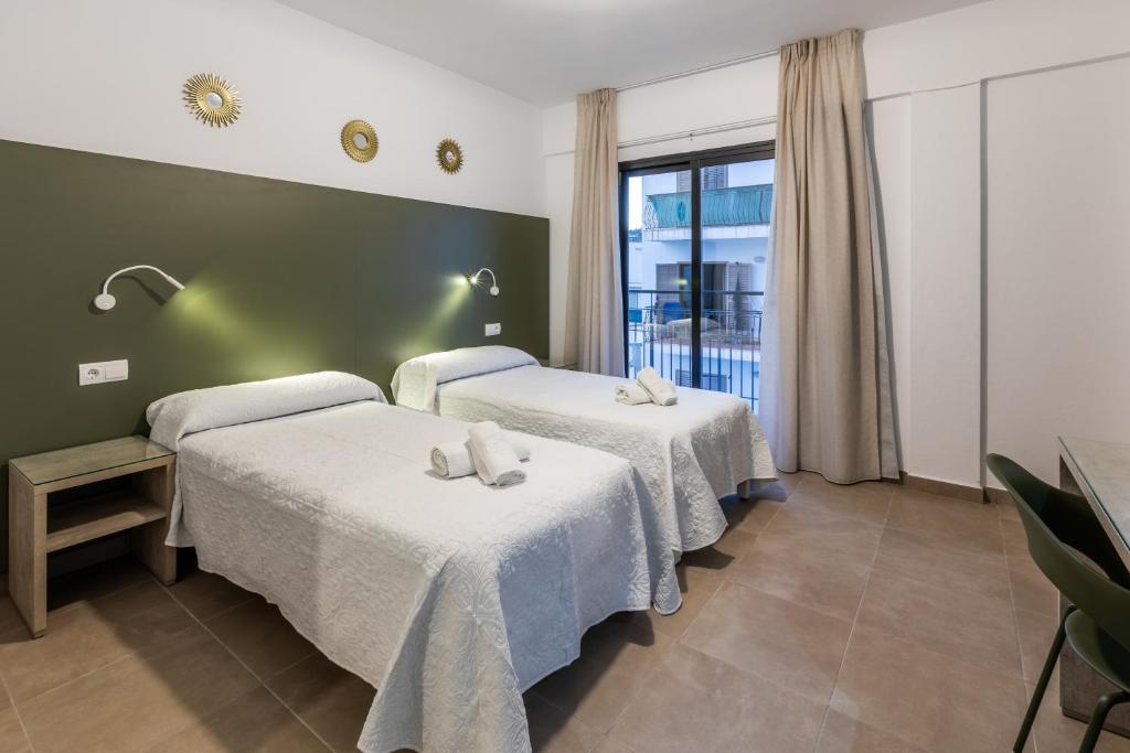 Postel nebo postele na pokoji v ubytování Hostal Alicante