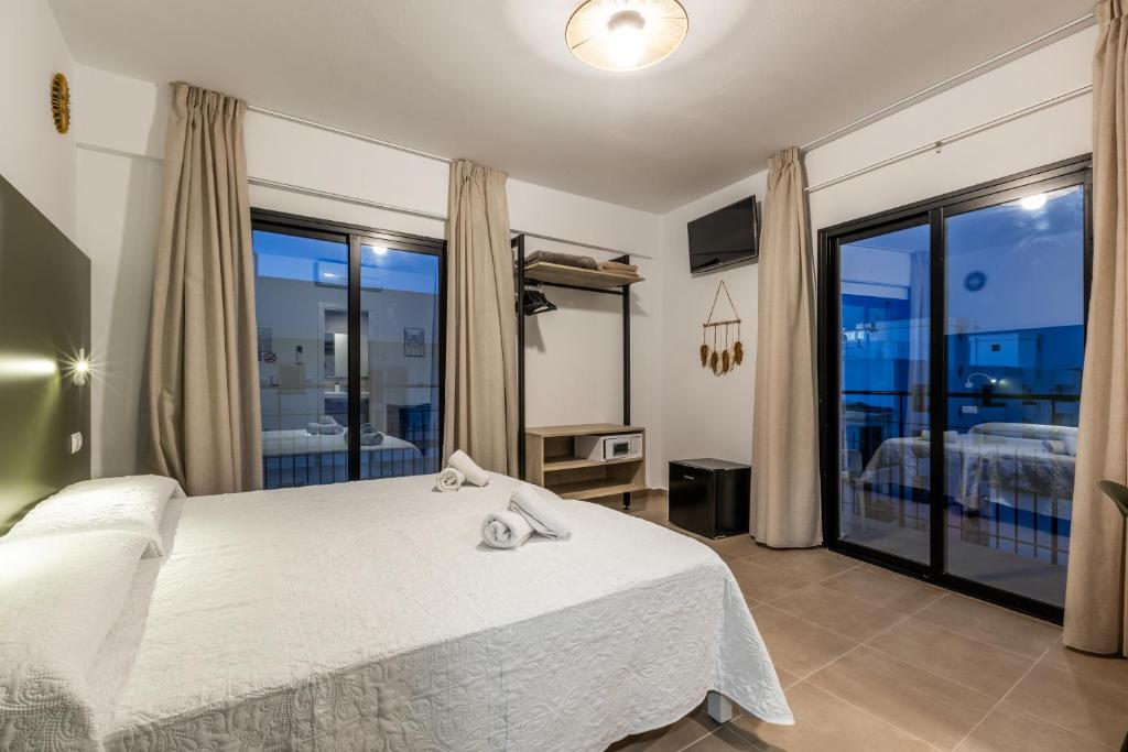 Postel nebo postele na pokoji v ubytování Hostal Alicante