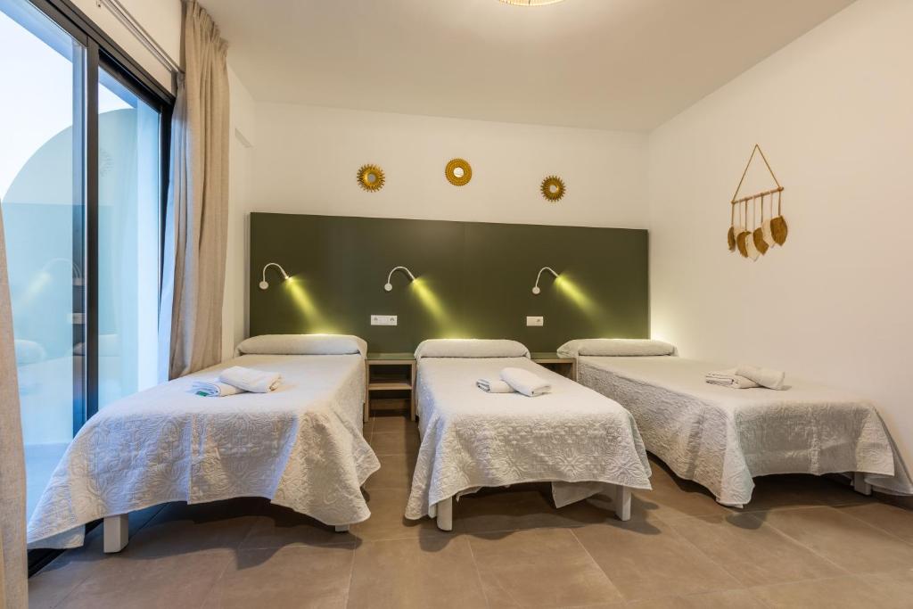 Postel nebo postele na pokoji v ubytování Hostal Alicante