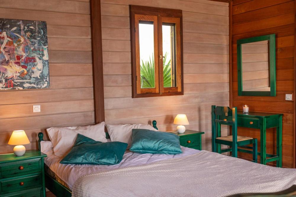 Postel nebo postele na pokoji v ubytování Elena Bungalows
