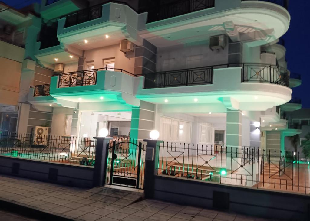 a building with green lights on the side of it at Hotel Calisto in Leptokarya